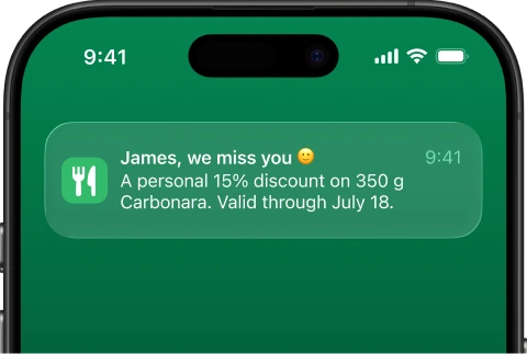 Push notification on a phone: “James, we miss you” — a personal 15% discount on 350 g Carbonara, valid through July 18.